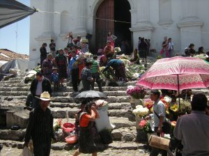At Santo Tomas, a Catholic church built atop a Maya altar in Chichicastenango, worshipers use symbols of both cultures. Photo by Barbara Borst