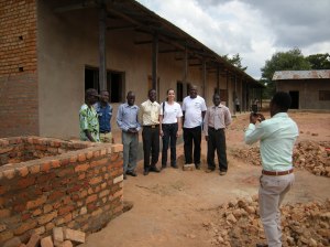 Maha Kashoor, center, field officer for the United Nations refugee agency, poses with new teachers at the new school in Mishamo settlement, Tanzania.