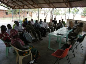 Community leaders in Ulyankulu, Tanzania, gather to speak with a visitor. 