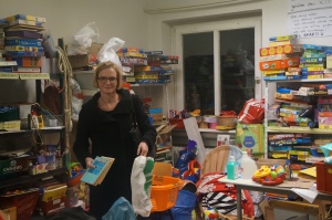 Ruth Stephan, an administrator at Karlsruhe Institute of Technology and lead organizer of Refugee Aid at KIT, in the supply room at the shelter for asylum seekers on the university's eastern campus. Photo by Kavitha Surana