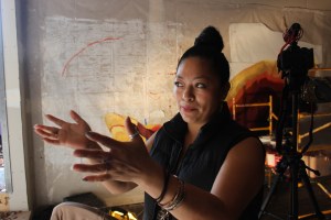 Leticia Reyes Garcia shown here during the painting of the mural in Sunset Park, Brooklyn. Photo by Nidia Bautista