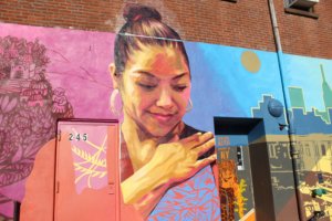 The “Our Journey Blossoms” mural covers the wall of the immigrant organization Mixteca's building in Sunset Park. Photo by Nidia Bautista