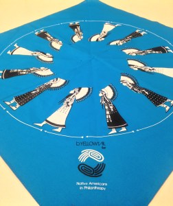 The scarf, designed by Bethany Yellowtail and John Isaiah Pepio, depicts the traditional women's war bonnet dance. Women of the advocacy movement Indigenous Women Rise wore the scarf to identify themselves at the Women's March on Washington. Photo by Clare Church